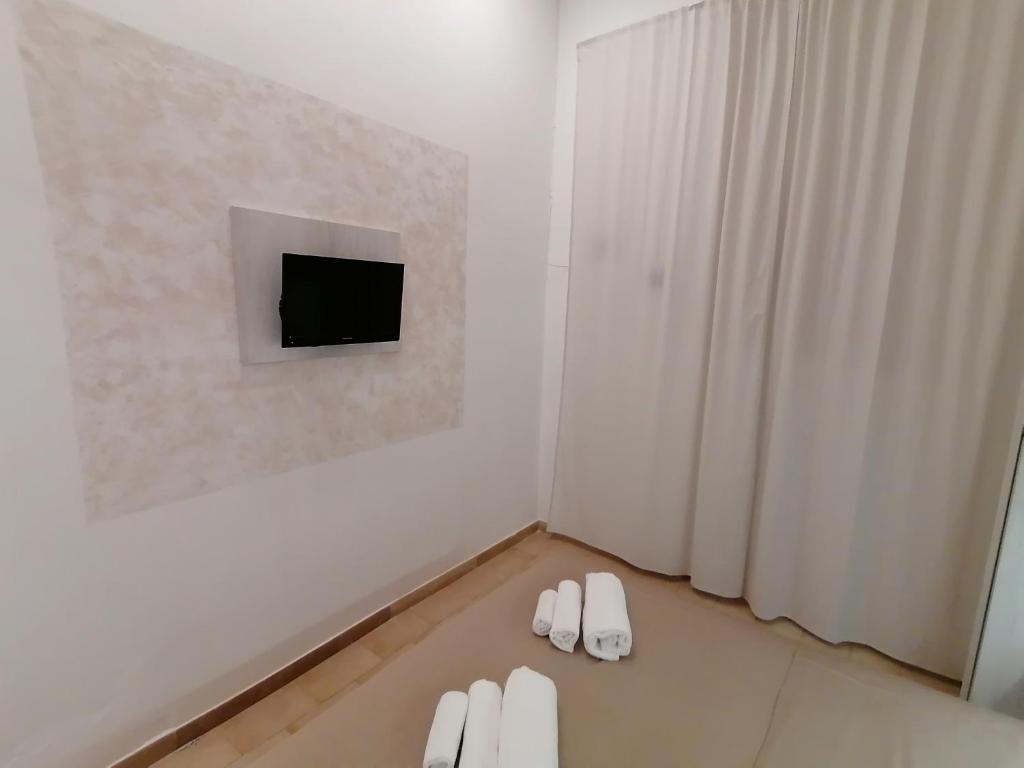 TV a/nebo společenská místnost v ubytování Hotel Cilene