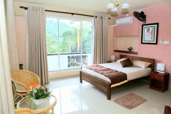 Postel nebo postele na pokoji v ubytování The Springfields Kandy Previously Madara Residence Kandy