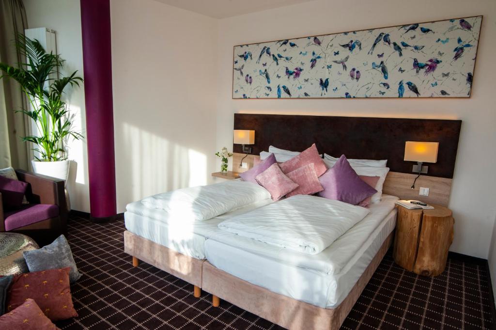 Postel nebo postele na pokoji v ubytování Business Class Hotel Ebersberg