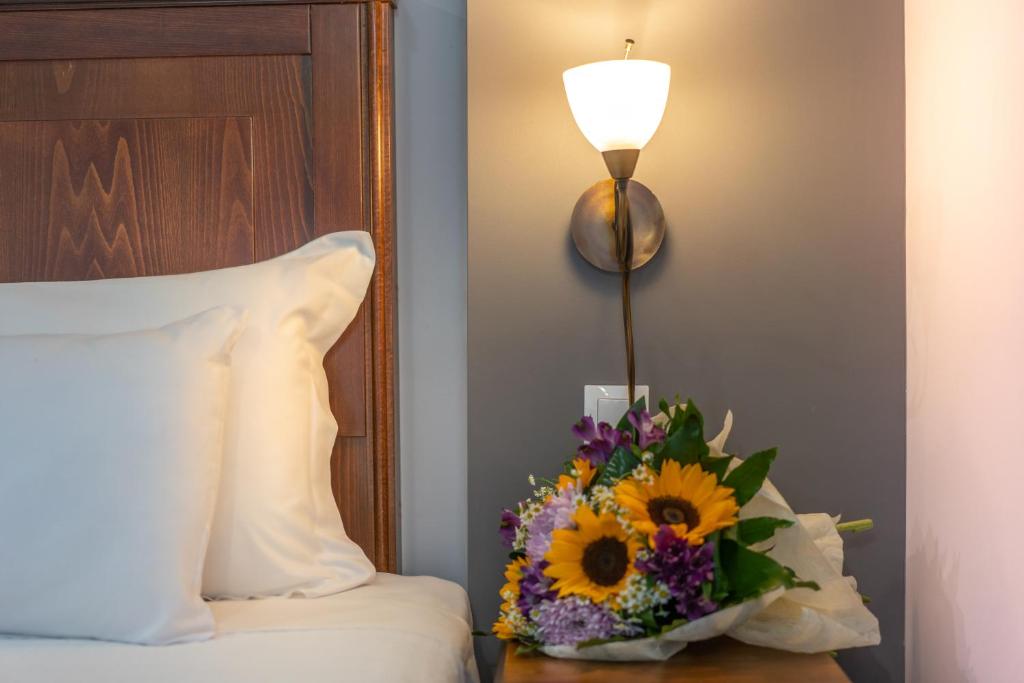Postel nebo postele na pokoji v ubytování Paralia Beach Boutique Hotel