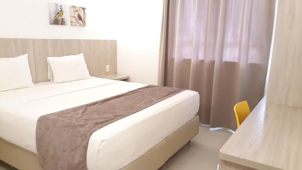 Postel nebo postele na pokoji v ubytování Pena Branca Hotel e Eventos