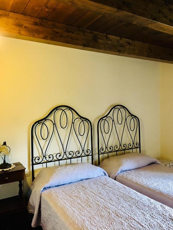 Posteľ alebo postele v izbe v ubytovaní Antico Borgo dell'Anconella - grande appartamento rustico