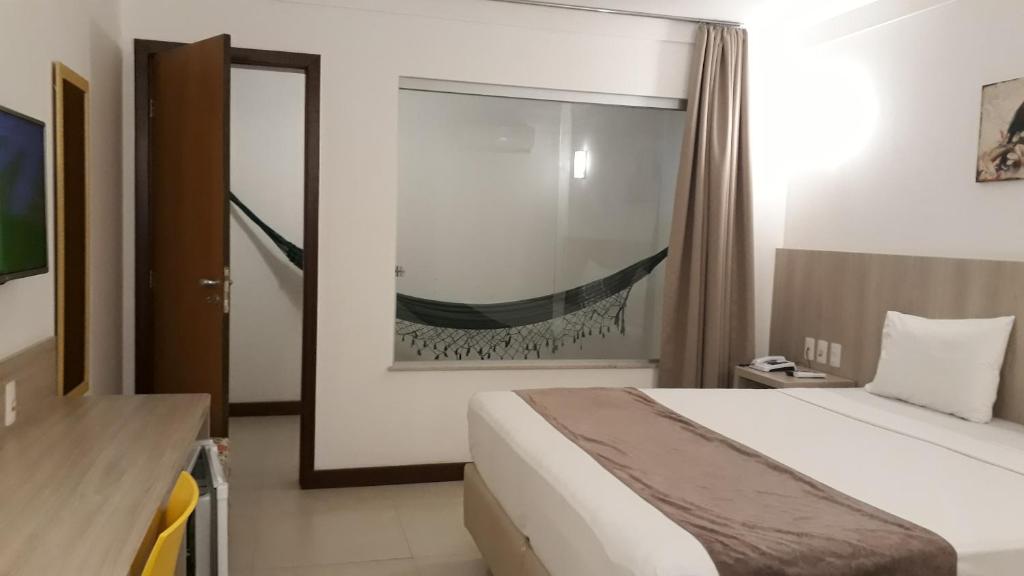 Postel nebo postele na pokoji v ubytování Pena Branca Hotel e Eventos