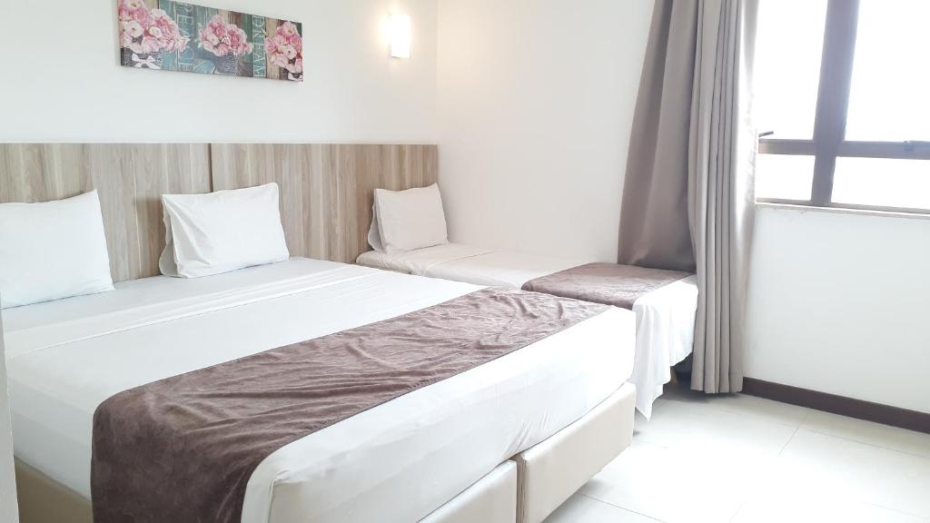 Postel nebo postele na pokoji v ubytování Pena Branca Hotel e Eventos
