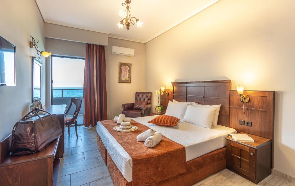 Postel nebo postele na pokoji v ubytování Paralia Beach Boutique Hotel