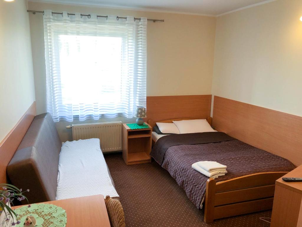 Posteľ alebo postele v izbe v ubytovaní Motel Orion