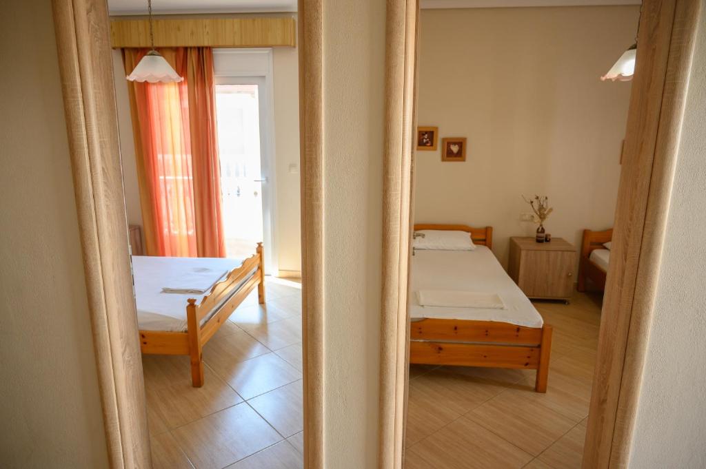 Postel nebo postele na pokoji v ubytování Anastasios Room's