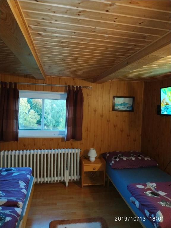 Postel nebo postele na pokoji v ubytování Pension Panorama