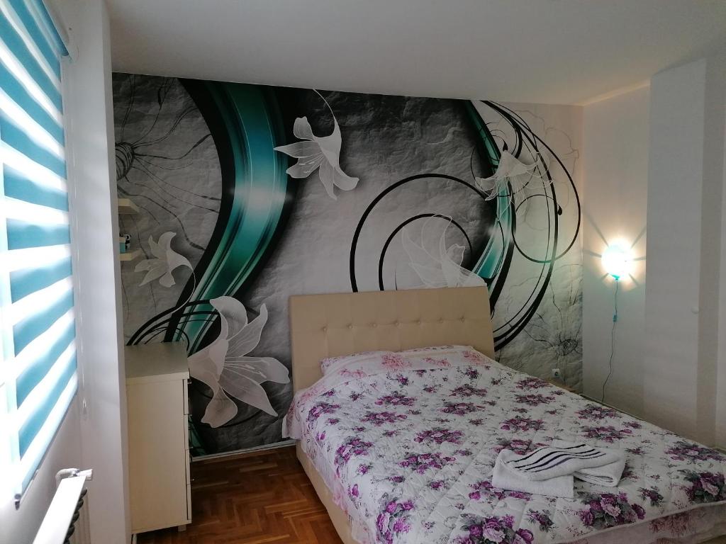 Postel nebo postele na pokoji v ubytování Apartman Aleksandar