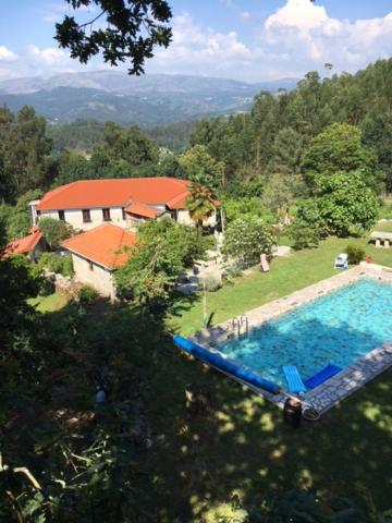 an aerial view of a house and a swimming pool at Quinta da Quinta in Vieira do Minho