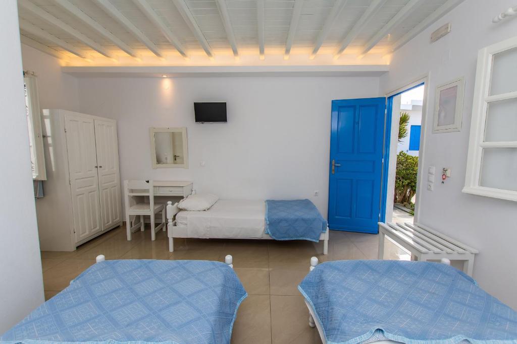 Postel nebo postele na pokoji v ubytování Mykonos Vouniotis Rooms