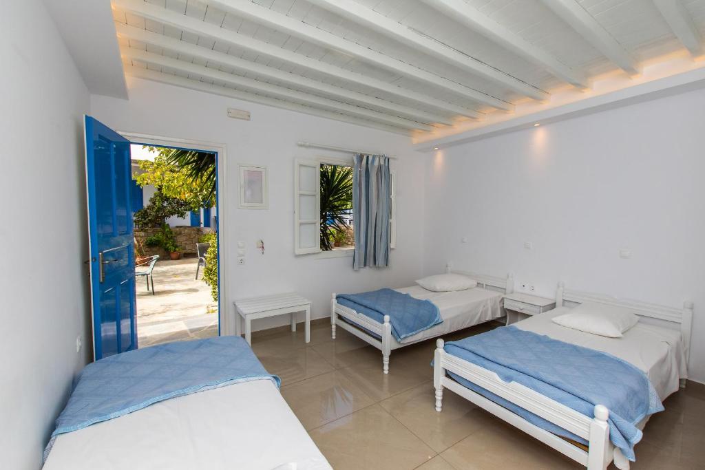 Postel nebo postele na pokoji v ubytování Mykonos Vouniotis Rooms
