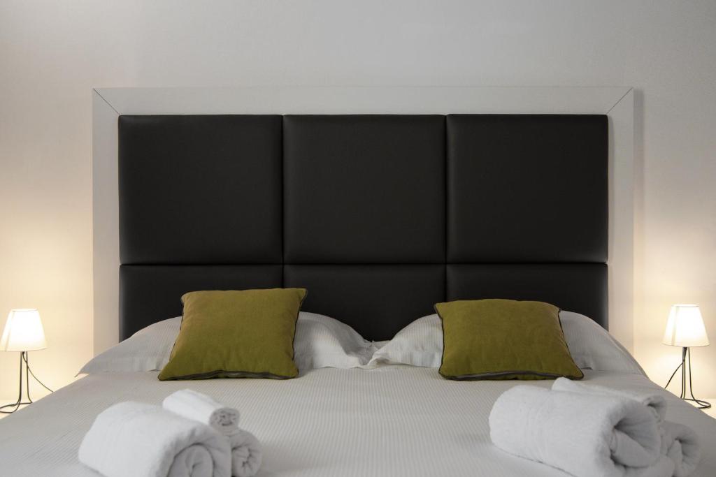 Postel nebo postele na pokoji v ubytování Interamnia Boutique Hotel