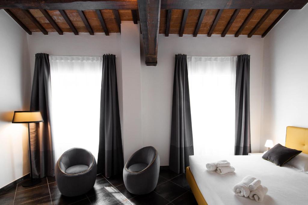 Postel nebo postele na pokoji v ubytování Interamnia Boutique Hotel