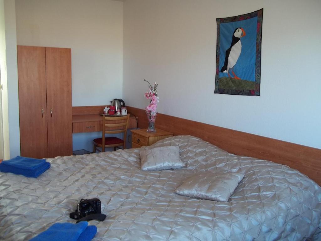 Postel nebo postele na pokoji v ubytování Hotel Breidavik