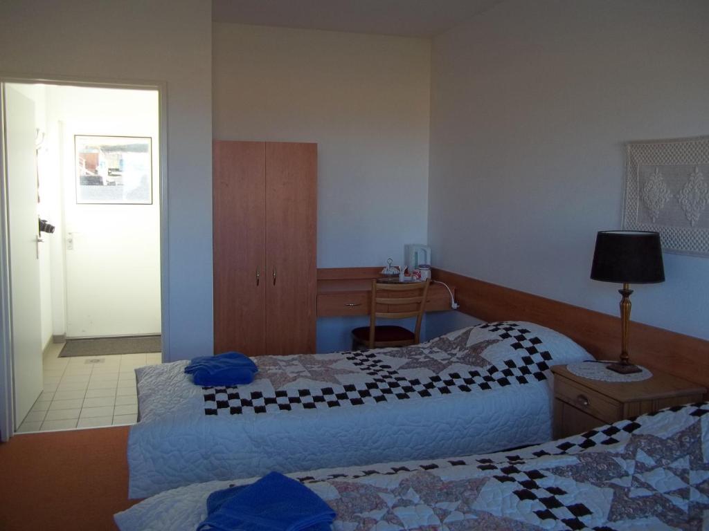 Postel nebo postele na pokoji v ubytování Hotel Breidavik