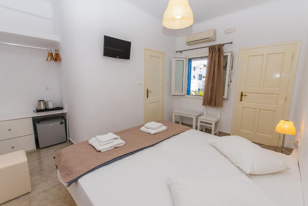 Postel nebo postele na pokoji v ubytování Mykonos Vouniotis Rooms