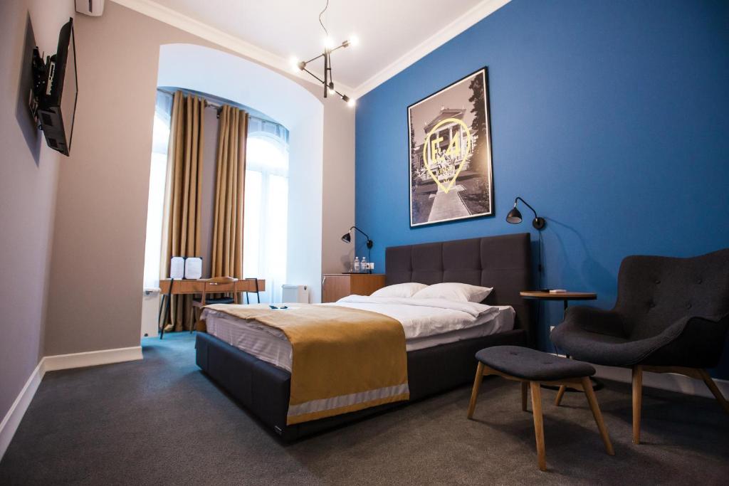 Postel nebo postele na pokoji v ubytování E4 Hotel