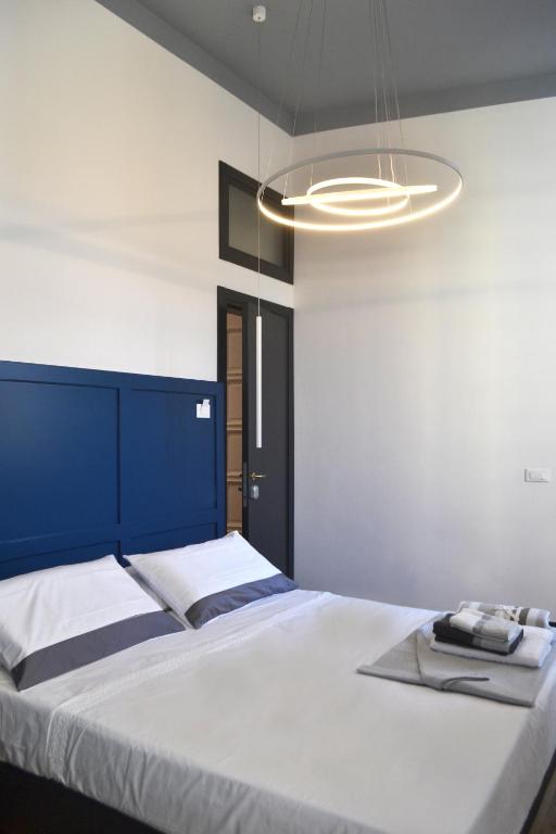 Postel nebo postele na pokoji v ubytování Da Domè Charm Rooms