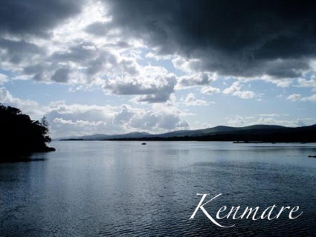 a large body of water with a cloudy sky at Neidin House in Kenmare