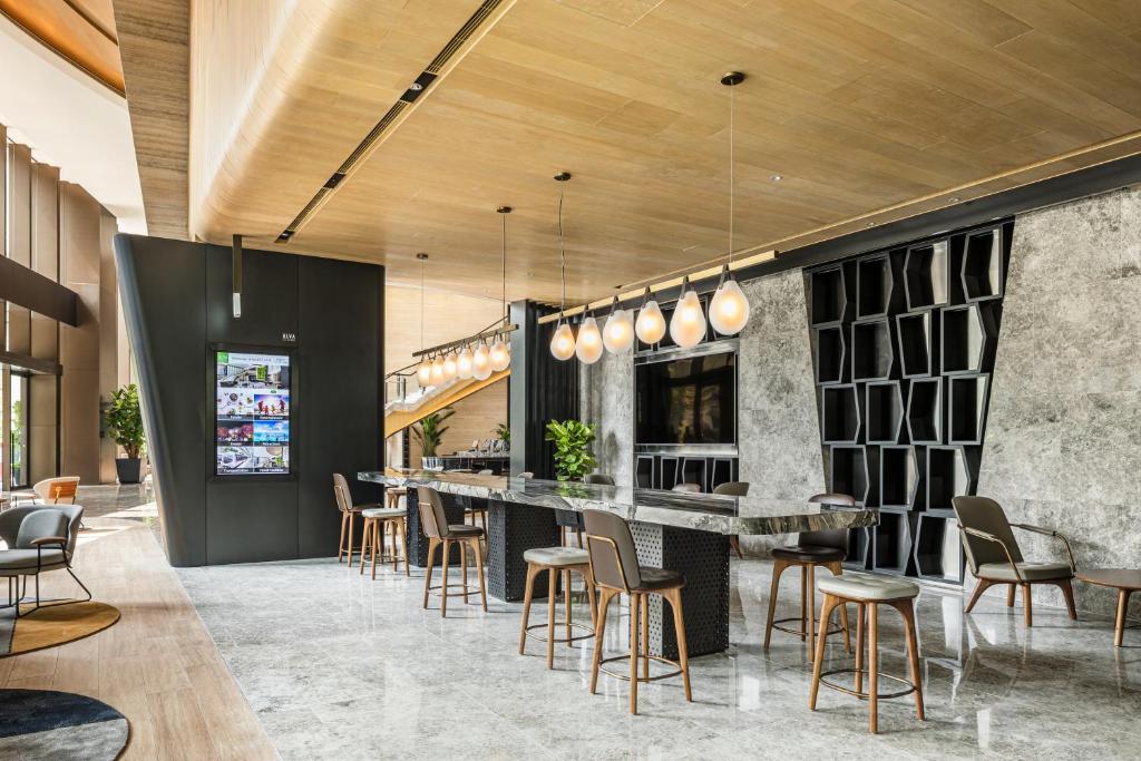 A television and/or entertainment centre at ALVA HOTEL BY ROYAL