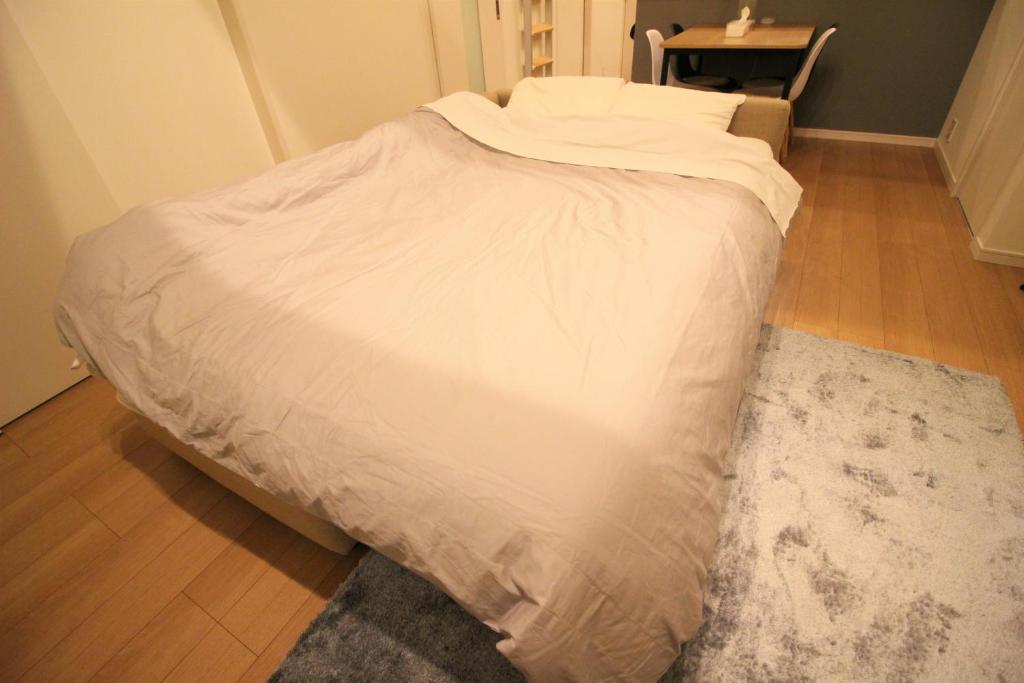 Postel nebo postele na pokoji v ubytování AddressHokancho