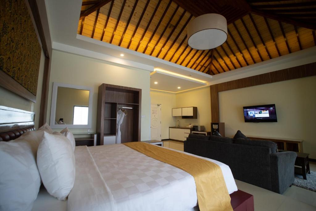 TV a/nebo společenská místnost v ubytování Luminor Hotel Banyuwangi By WH