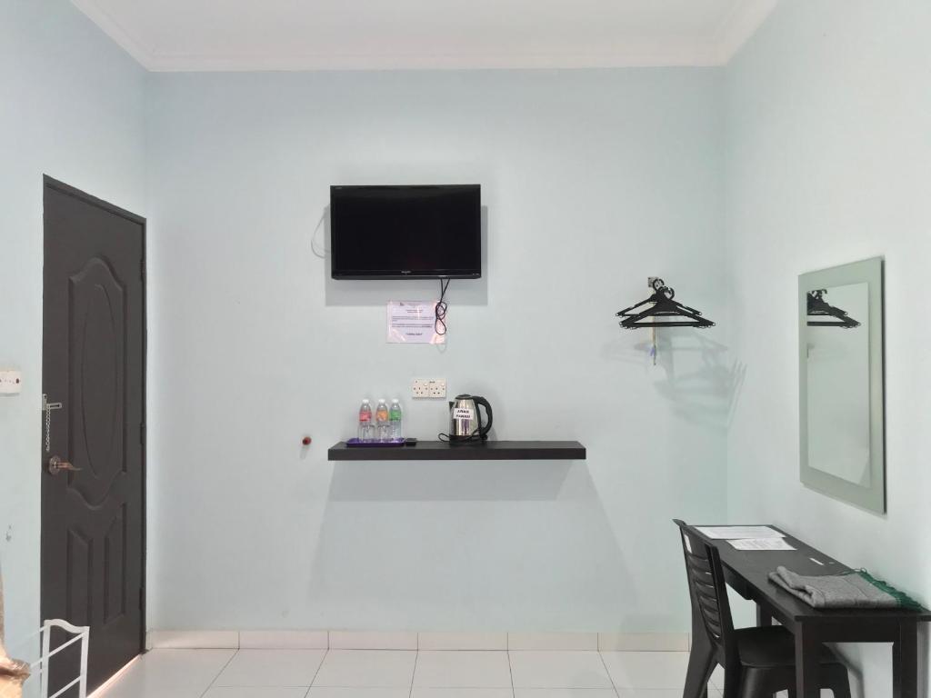 TV a/nebo společenská místnost v ubytování Changlun Chalet