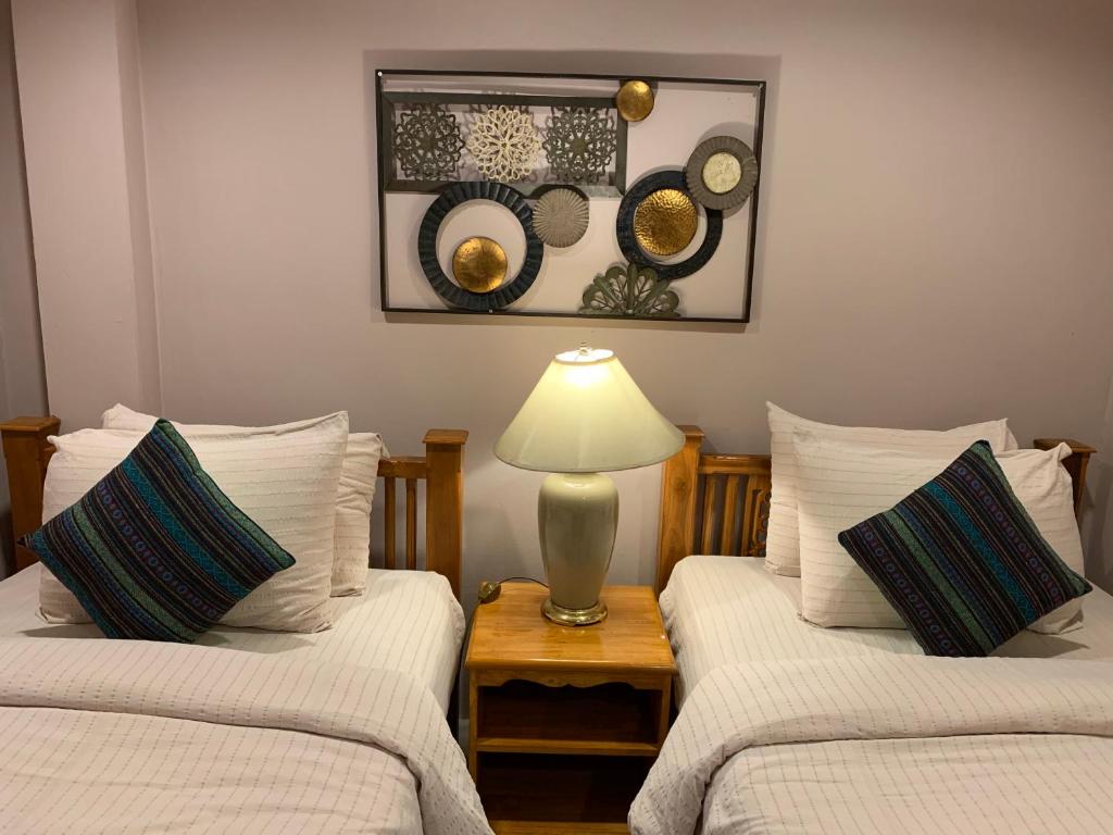 Кровать или кровати в номере Richmond Guesthouse Haad Rin