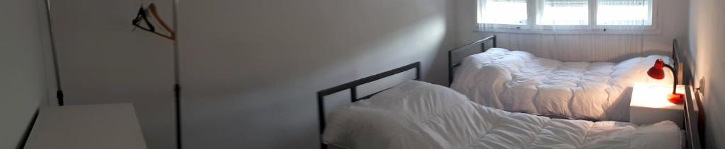 Postel nebo postele na pokoji v ubytování Edelweiss Hostel