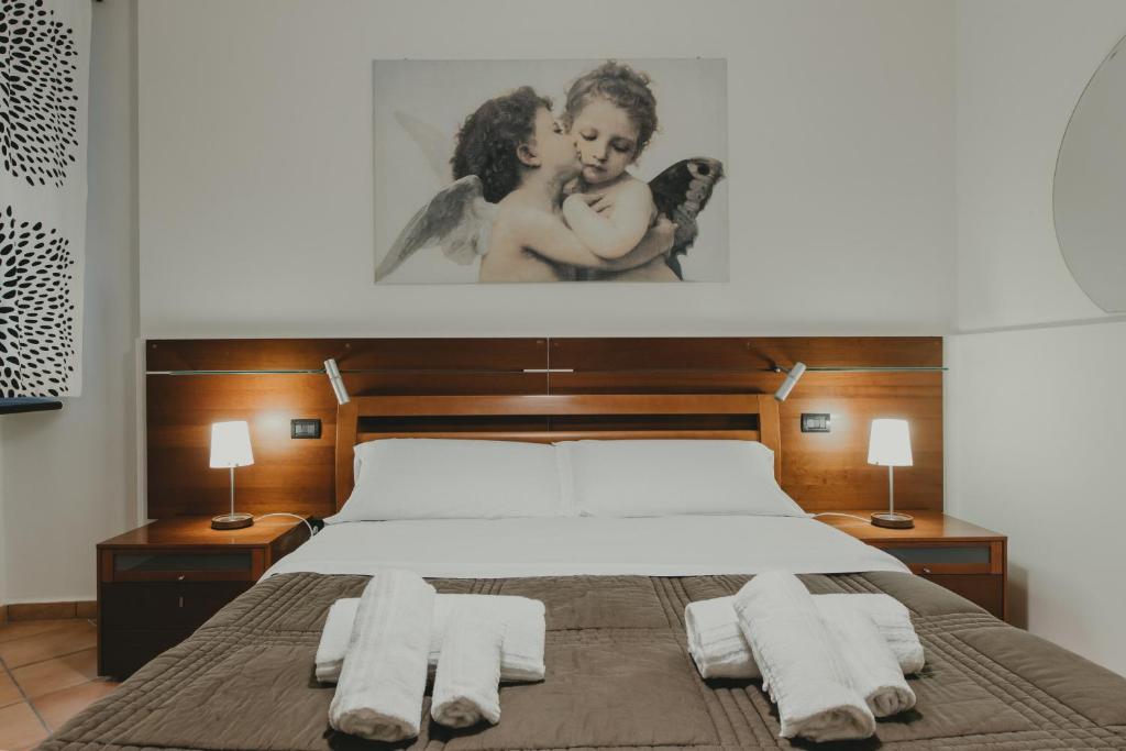 Posteľ alebo postele v izbe v ubytovaní Osimo Caves Rooms