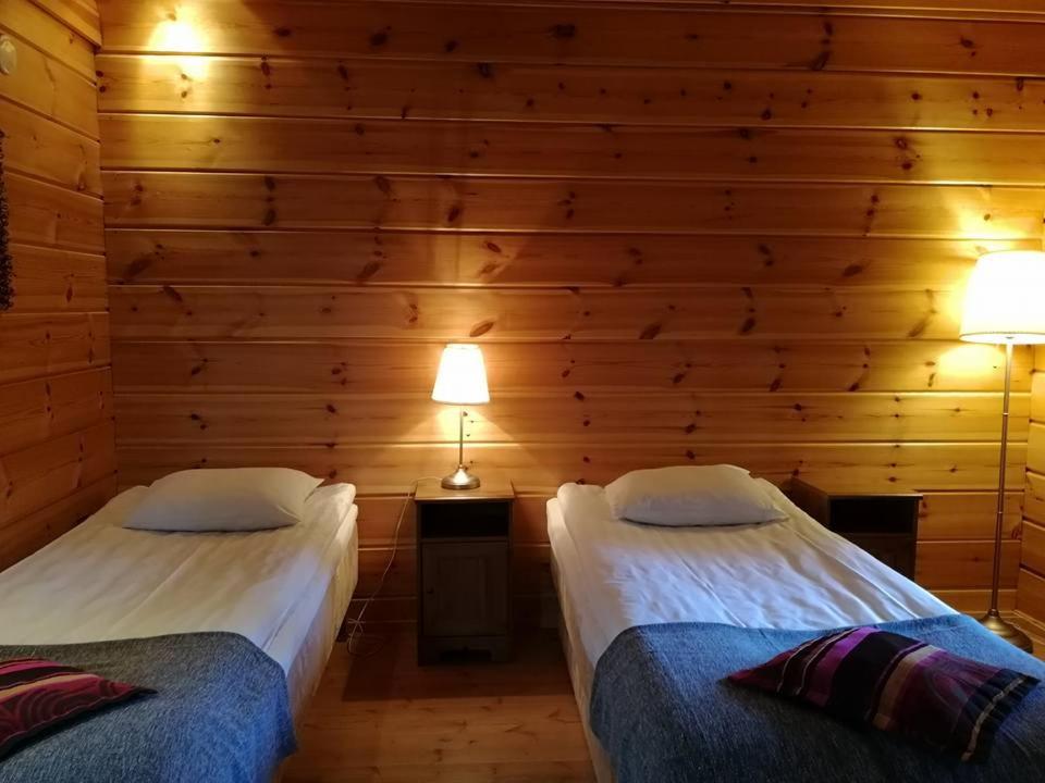 Postel nebo postele na pokoji v ubytování Santa's Little Village - Hotel Uitonniemi