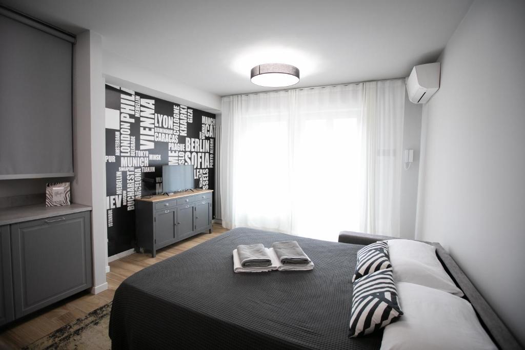 Postel nebo postele na pokoji v ubytování Donizetti Residence