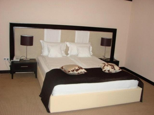 Postel nebo postele na pokoji v ubytování Griff Hotel Zalau