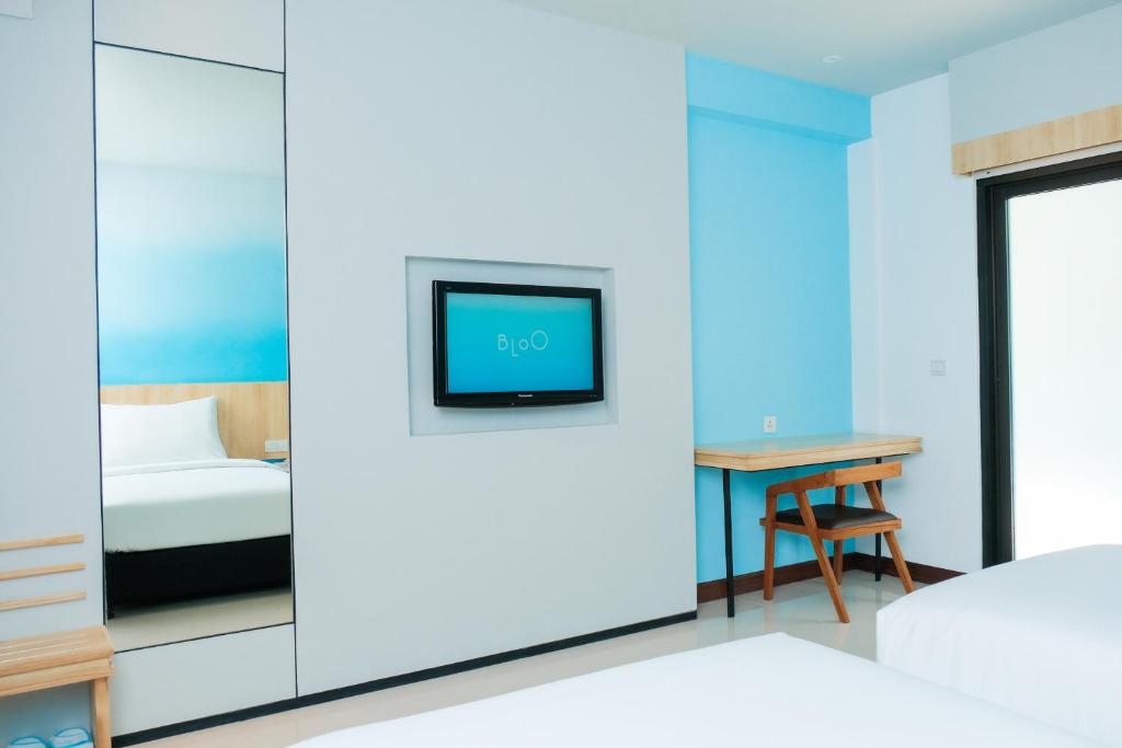 Postel nebo postele na pokoji v ubytování Bloo Bali Hotel