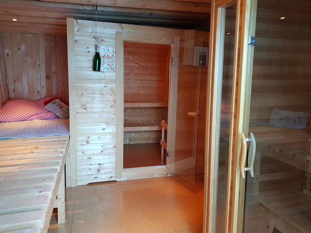 a small room with a bed and a closet at Der Perweinhof in Donnersbachwald