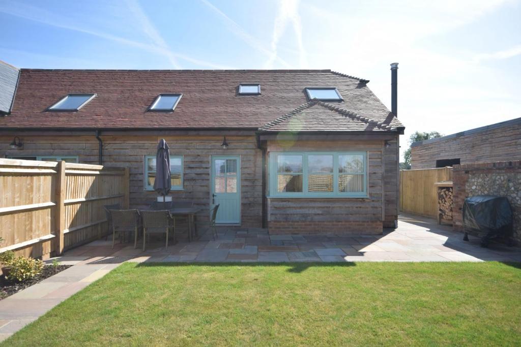 a small house with a patio and a fence at The Parlour , Emsworth in Emsworth