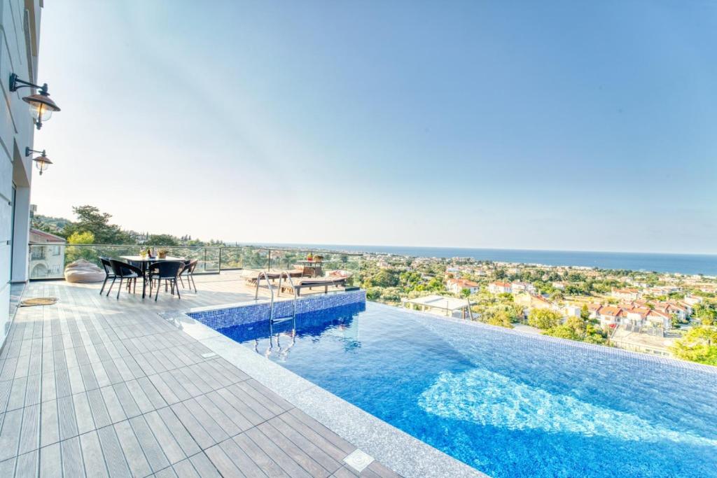 a swimming pool with a view of the ocean at Spectacular Villa In Kyrenia in Kyrenia