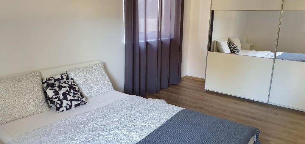 Posteľ alebo postele v izbe v ubytovaní Zielone Apartamenty Katowice Chorzów