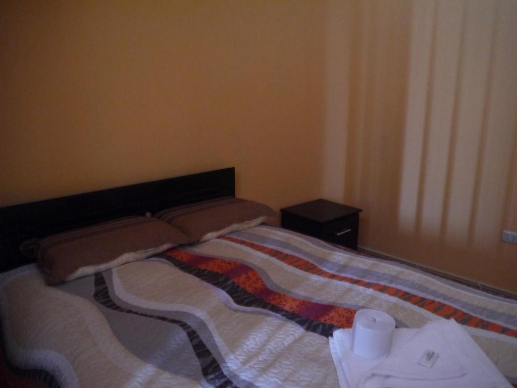 Postel nebo postele na pokoji v ubytování Hotel Suite Juliaca
