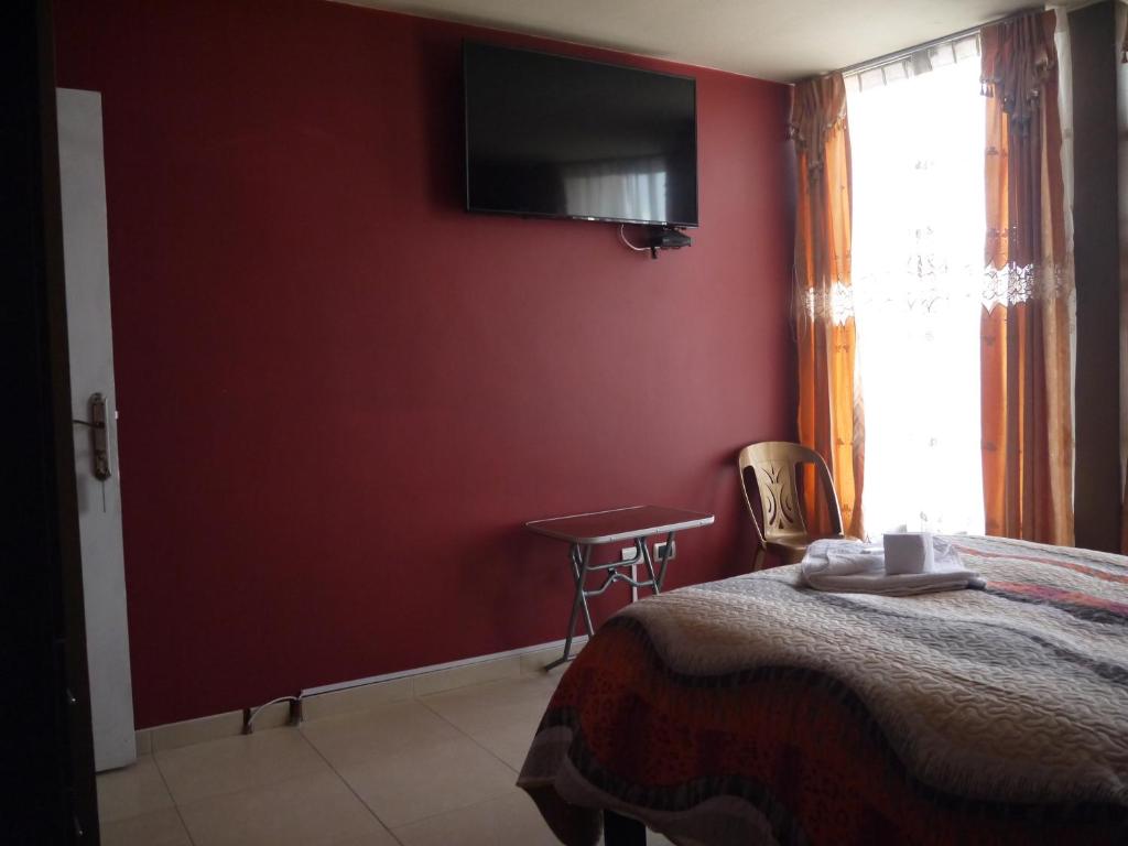 TV a/nebo společenská místnost v ubytování Hotel Suite Juliaca