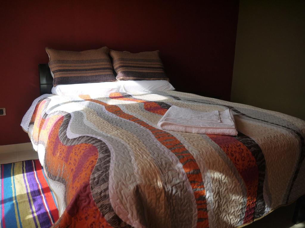 Postel nebo postele na pokoji v ubytování Hotel Suite Juliaca