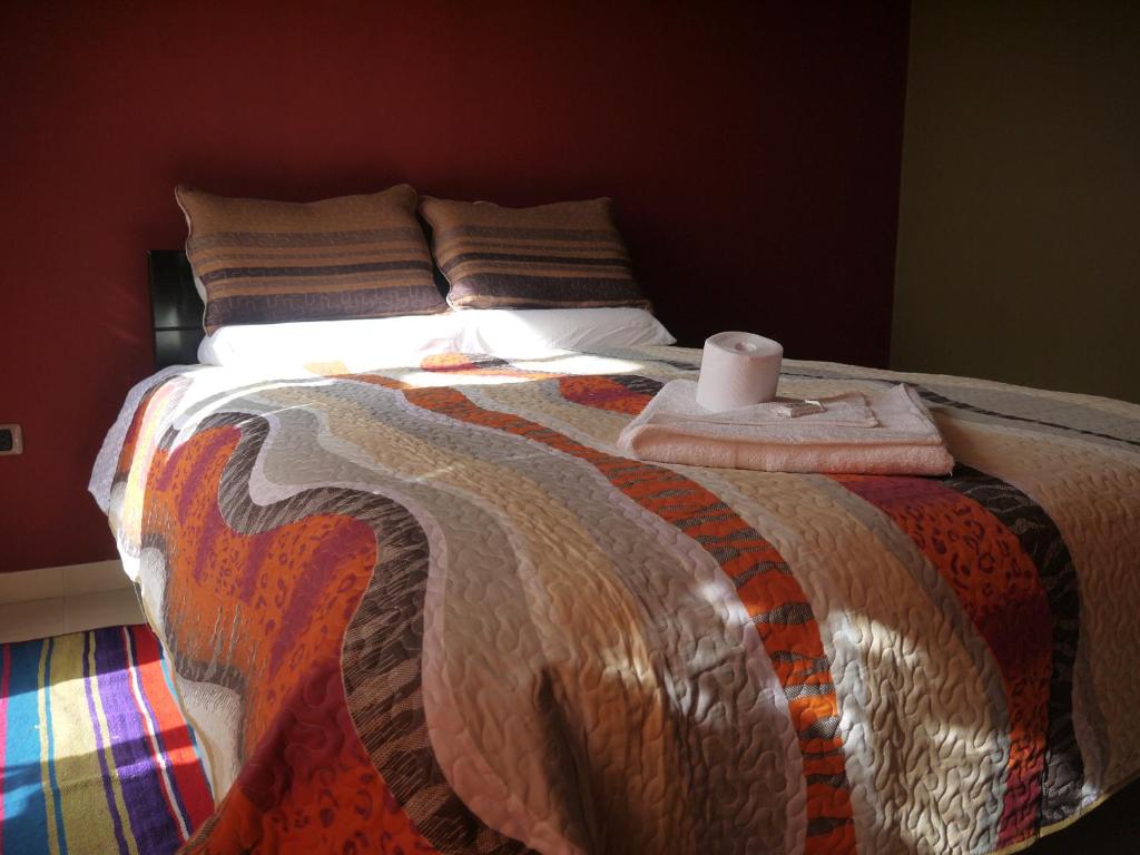 Postel nebo postele na pokoji v ubytování Hotel Suite Juliaca