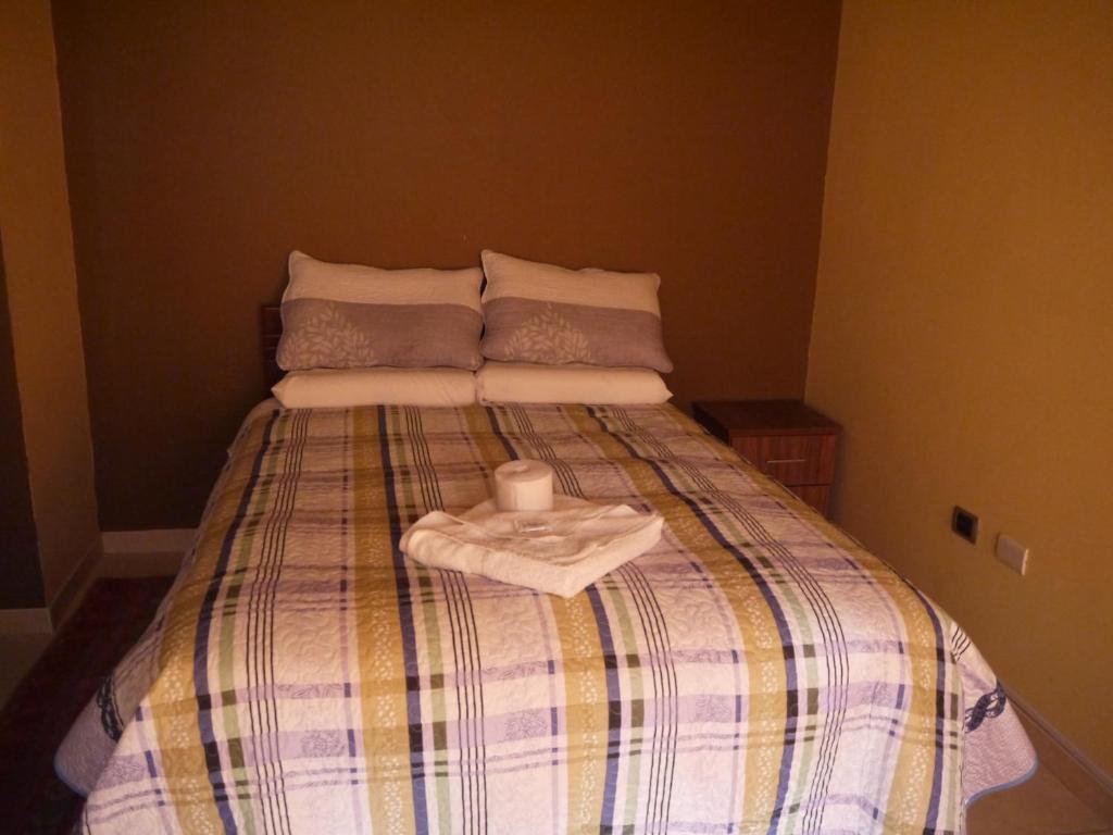Postel nebo postele na pokoji v ubytování Hotel Suite Juliaca