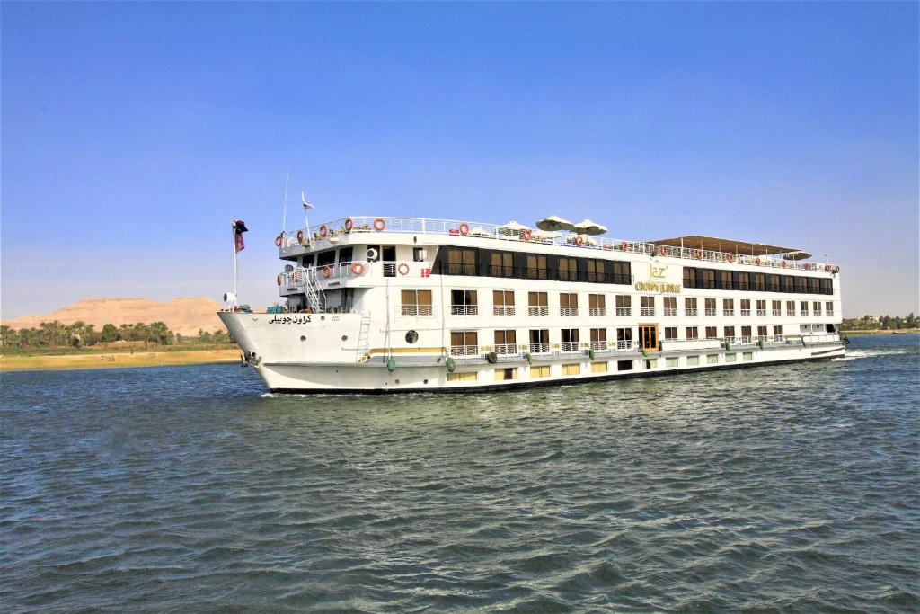 a large white cruise ship on the water at Jaz Crown Jubilee Nile Cruise - Every Thursday from Luxor for 07 & 04 Nights - Every MondayFrom Aswan for 03 Nights in Luxor