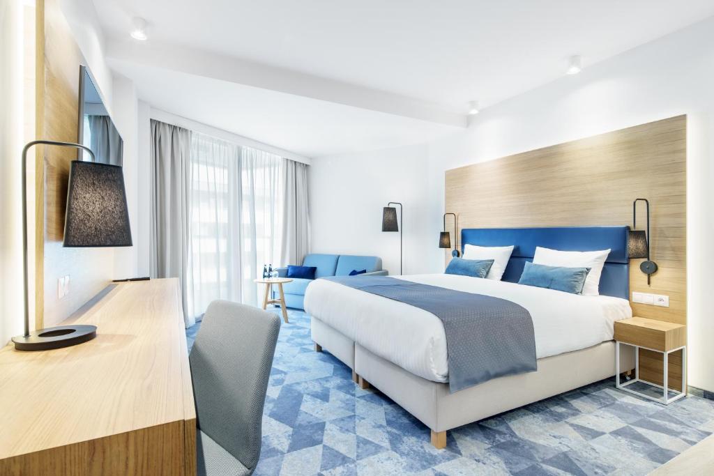 Postel nebo postele na pokoji v ubytování Seaside Park Hotel