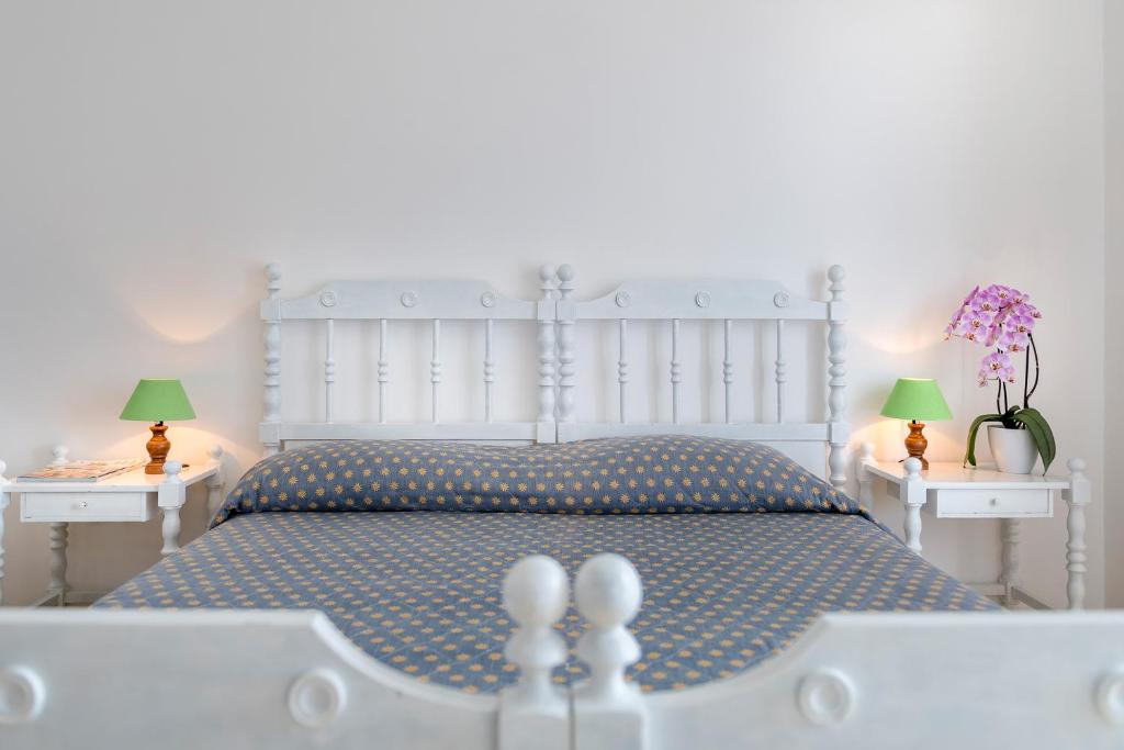 
Ein Bett oder Betten in einem Zimmer der Unterkunft Hotel la Perla
