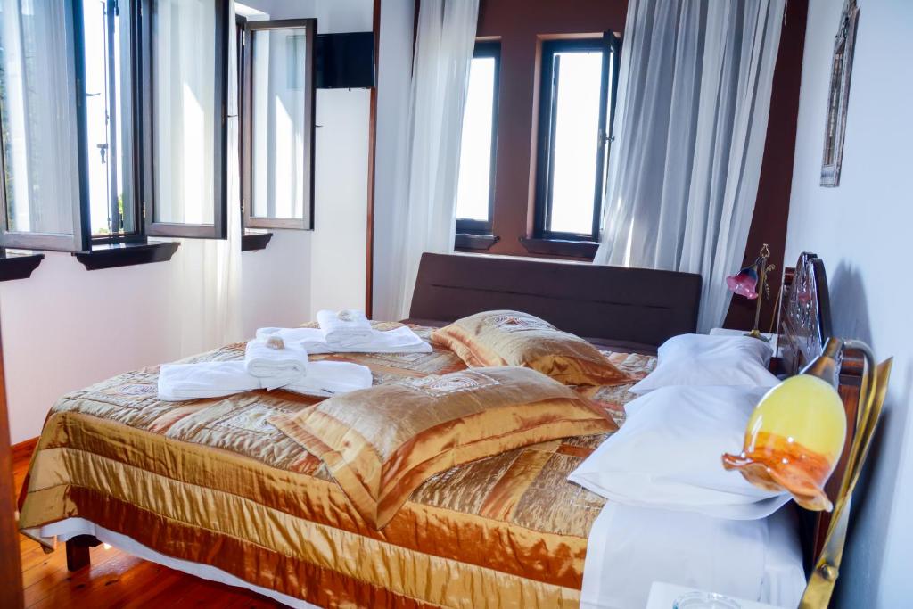 Postel nebo postele na pokoji v ubytování Hotel Adam