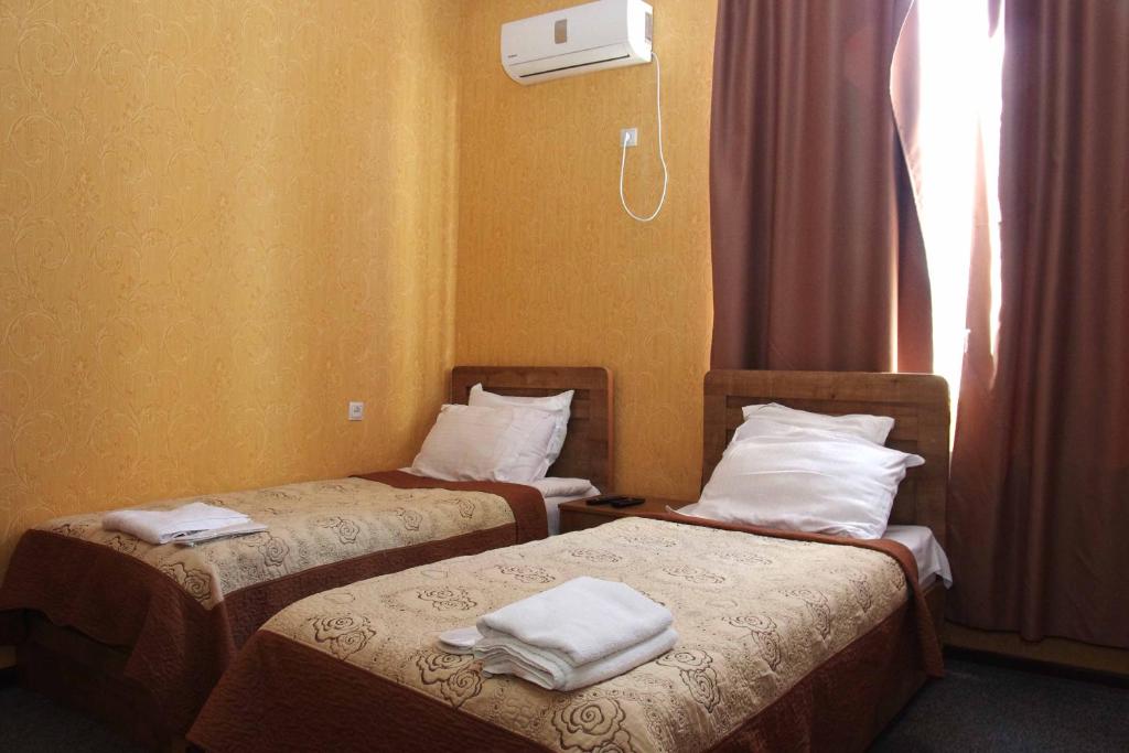 Postel nebo postele na pokoji v ubytování Hotel Shalimar
