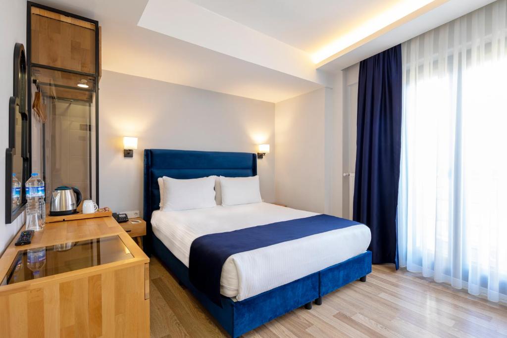 Postel nebo postele na pokoji v ubytování DORUK PALAS HOTEL
